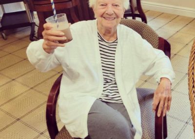 A female resident enjoying a coffee