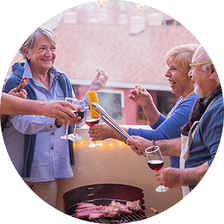 A group of people enjoying drinks and laughing