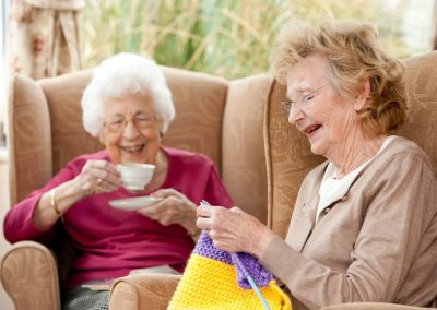 Residents enjoying tea and knitting